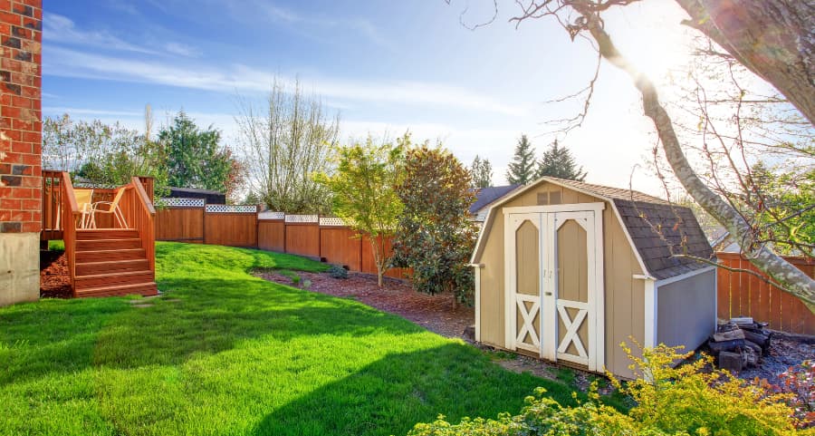 Fenced backyard with storage shed in Alpharetta